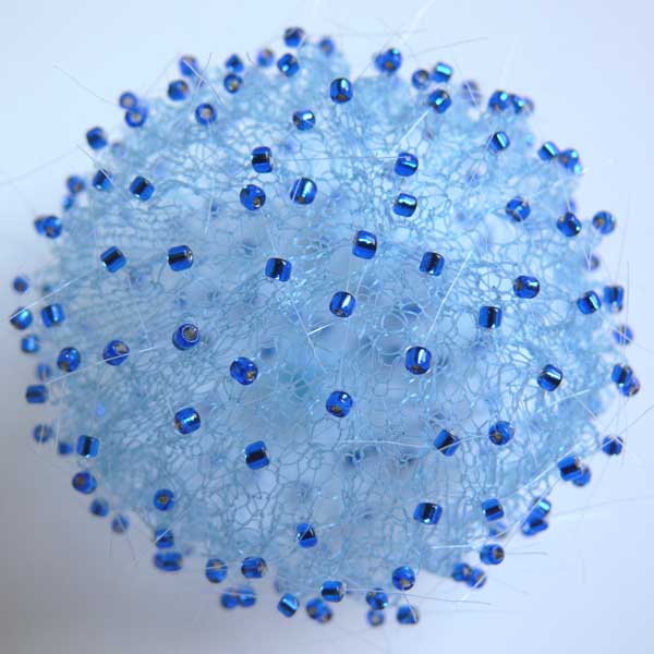 Blue Pollen|Blue Pollen 2008<br/>earrings<br/>knitted dyed nylon<br/>diameter: 7cm / 2.75inches, height: 7.5cm / 3 inches <br/><br/>I discovered the beauty of the tiny pollen grains after watching The Private Life of plants series on TV. The intricate patterned shells fascinated me. My interpretation is not at all scientific, my appreciation of the structure of these extraordinary sculptural cells inspired me to make these pieces.